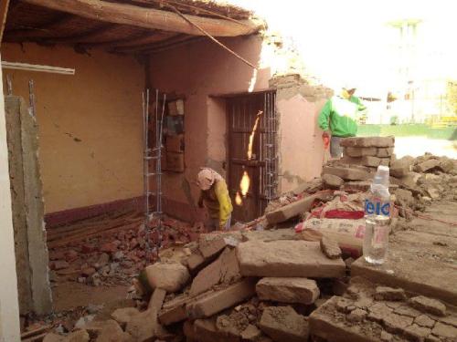 Demolition of the adobe house in front of mission