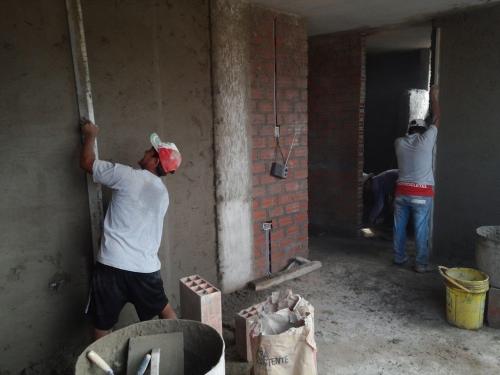  Men's dorm has three workers doing tarrajear process 